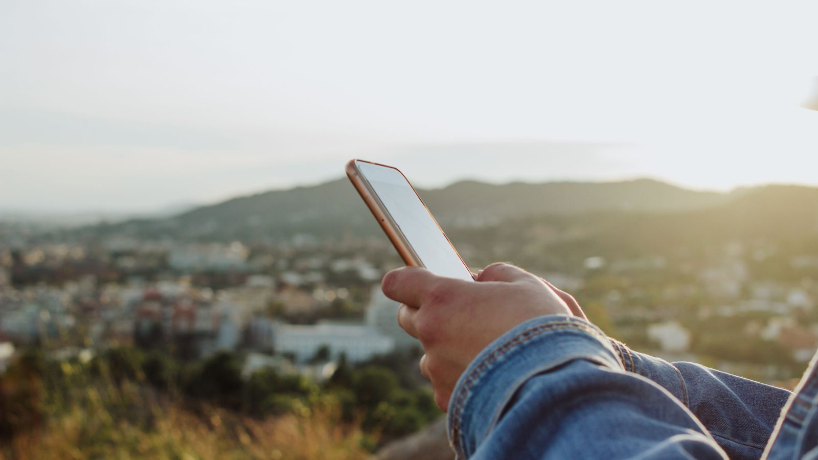 Mobile phone in Arizona desert representing reliable Arizona internet service coverage