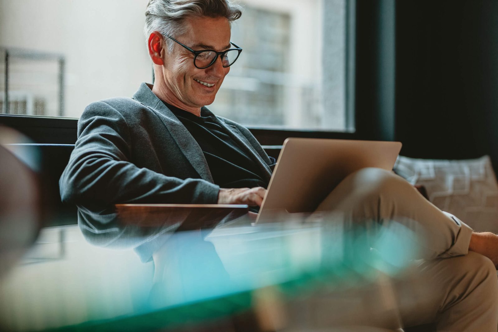Business professional working on a laptop with reliable Bluespan business internet