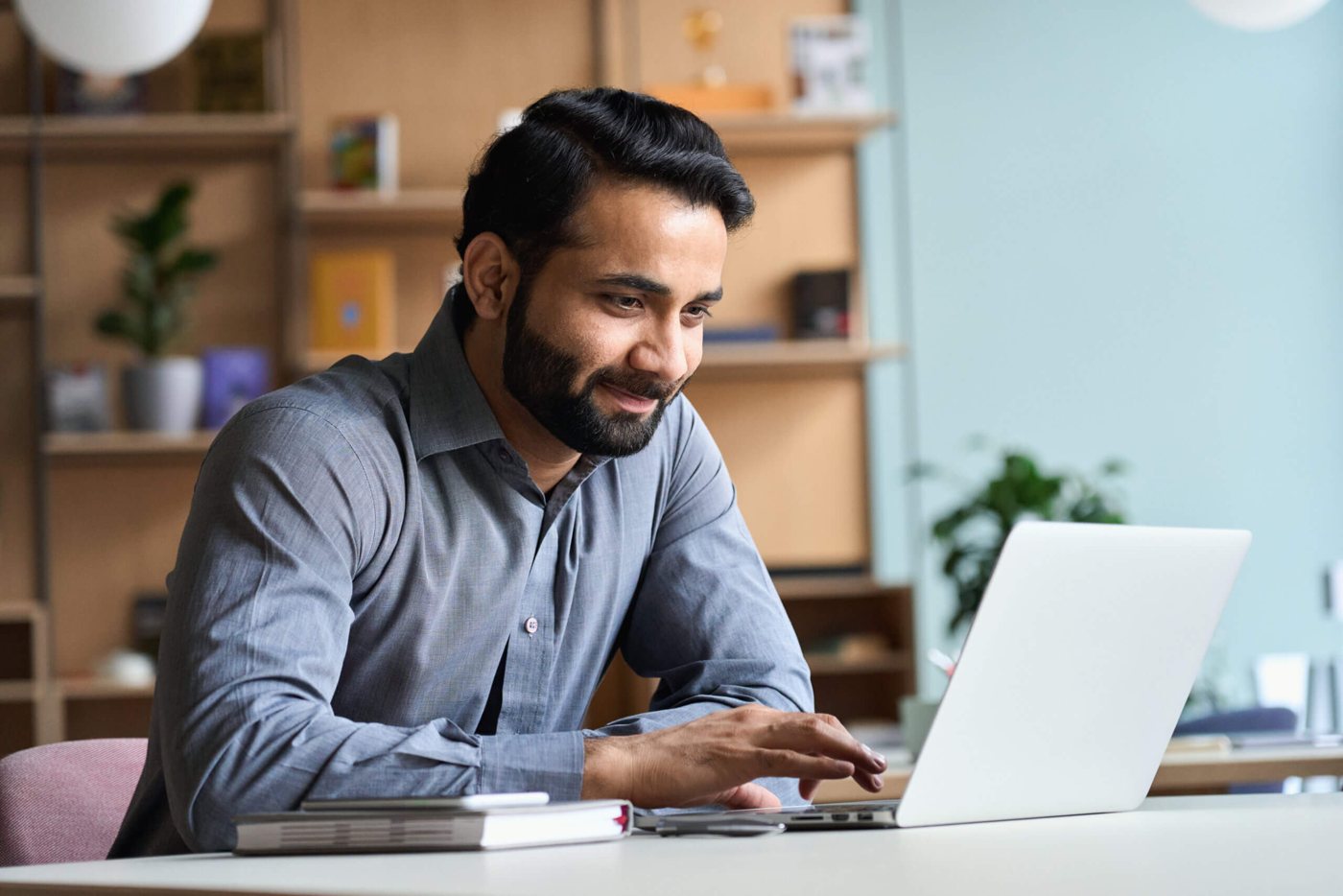 Person using a laptop on fast Bluespan internet at home