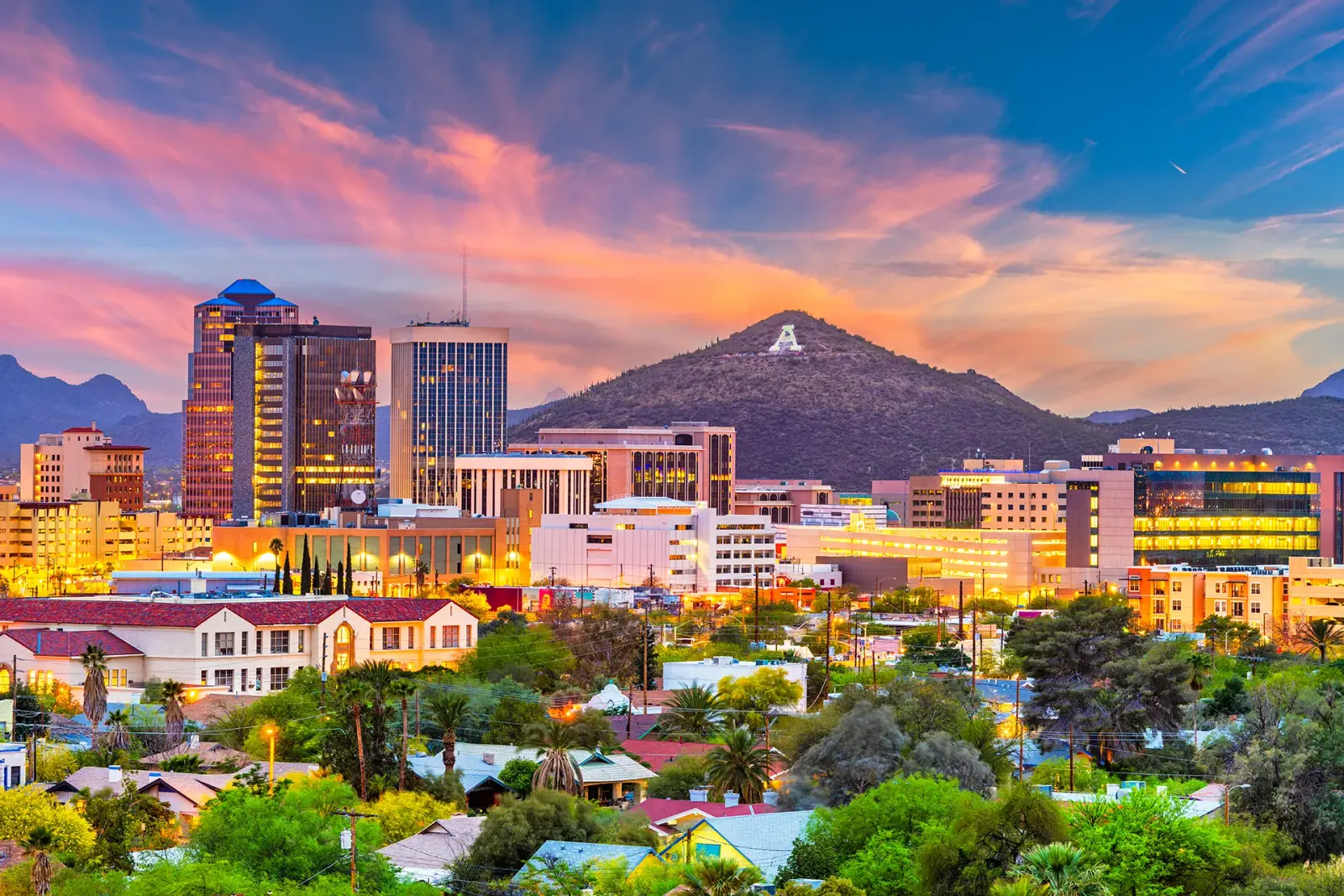 Downtown Tucson skyline at sunset with Sentinel Peak, home of locally owned internet provider Bluespan