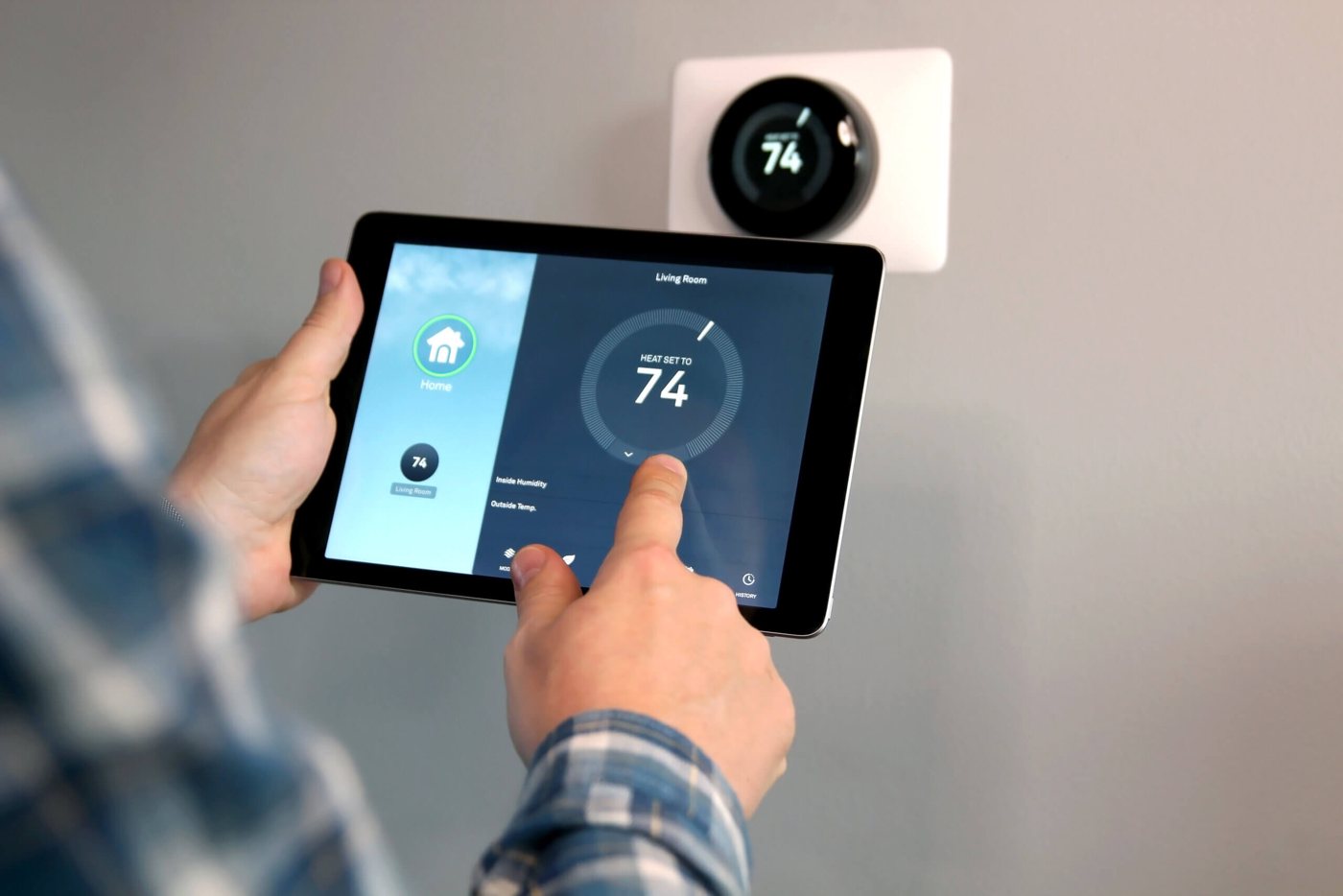 Smart home thermostat connected to laptop using residential broadband internet