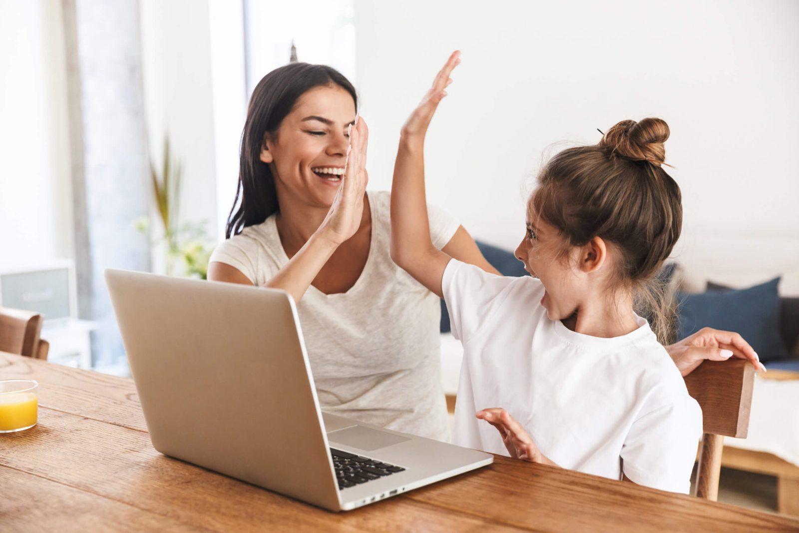 Parent and child celebrating homework success with reliable high speed internet Arizona