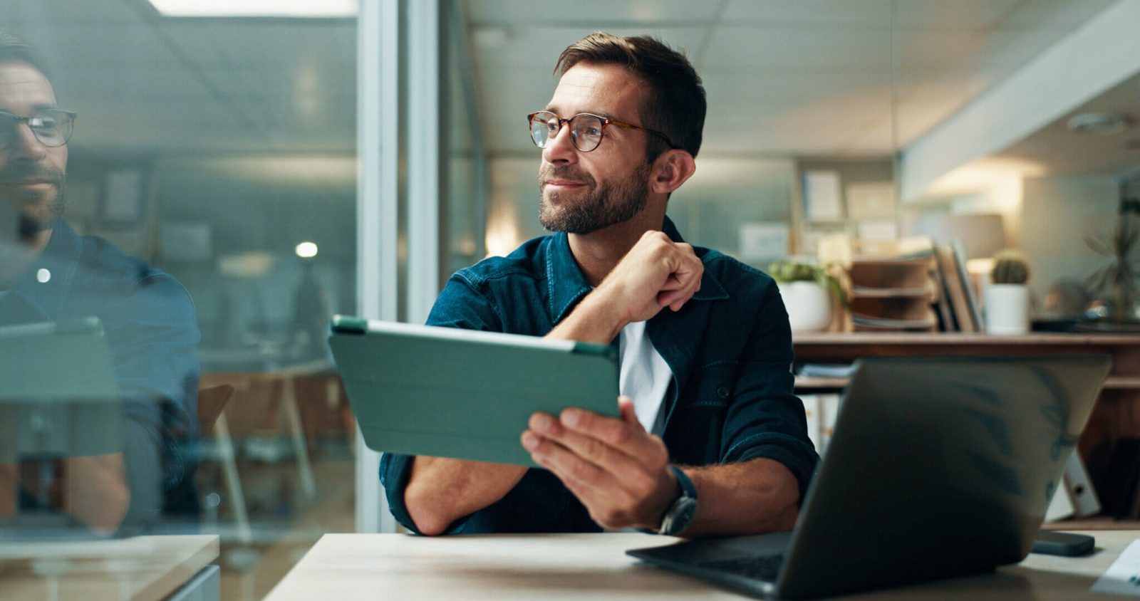 Professional using tablet in coworking space with reliable internet service support