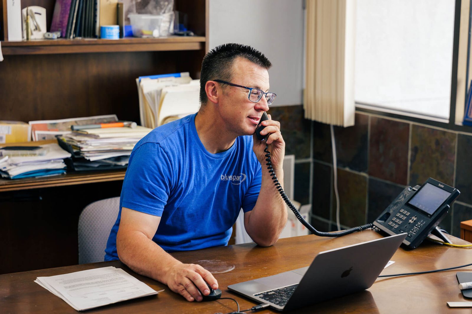 Chris, Bluespan team member, providing friendly internet service support to local customers by phone