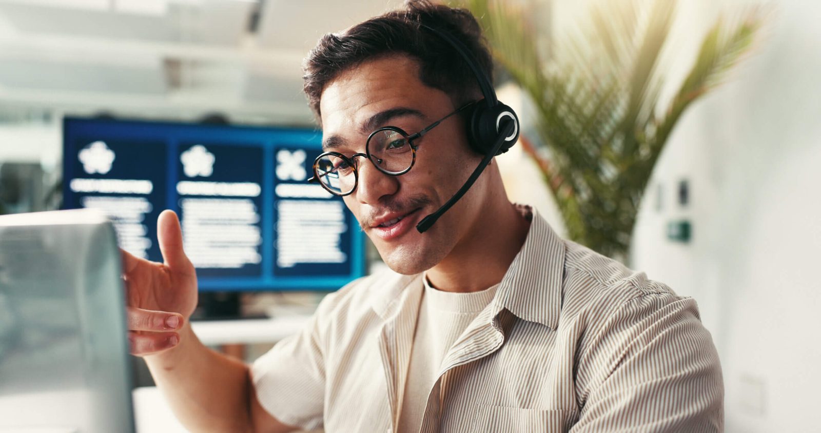 Bluespan support specialist with a headset helping a Tucson customer troubleshoot their internet